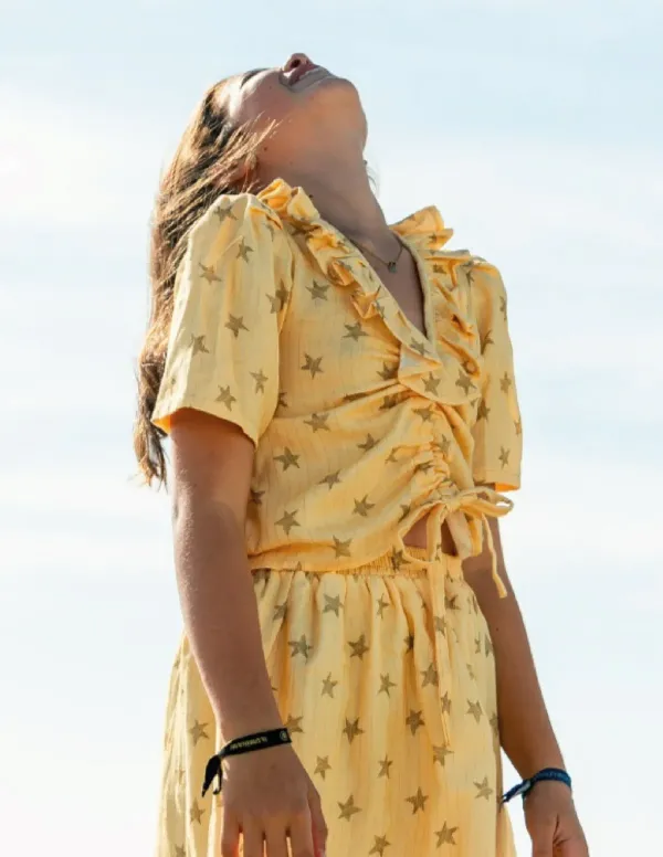 FALDA ESTRELLAS MOSTAZA